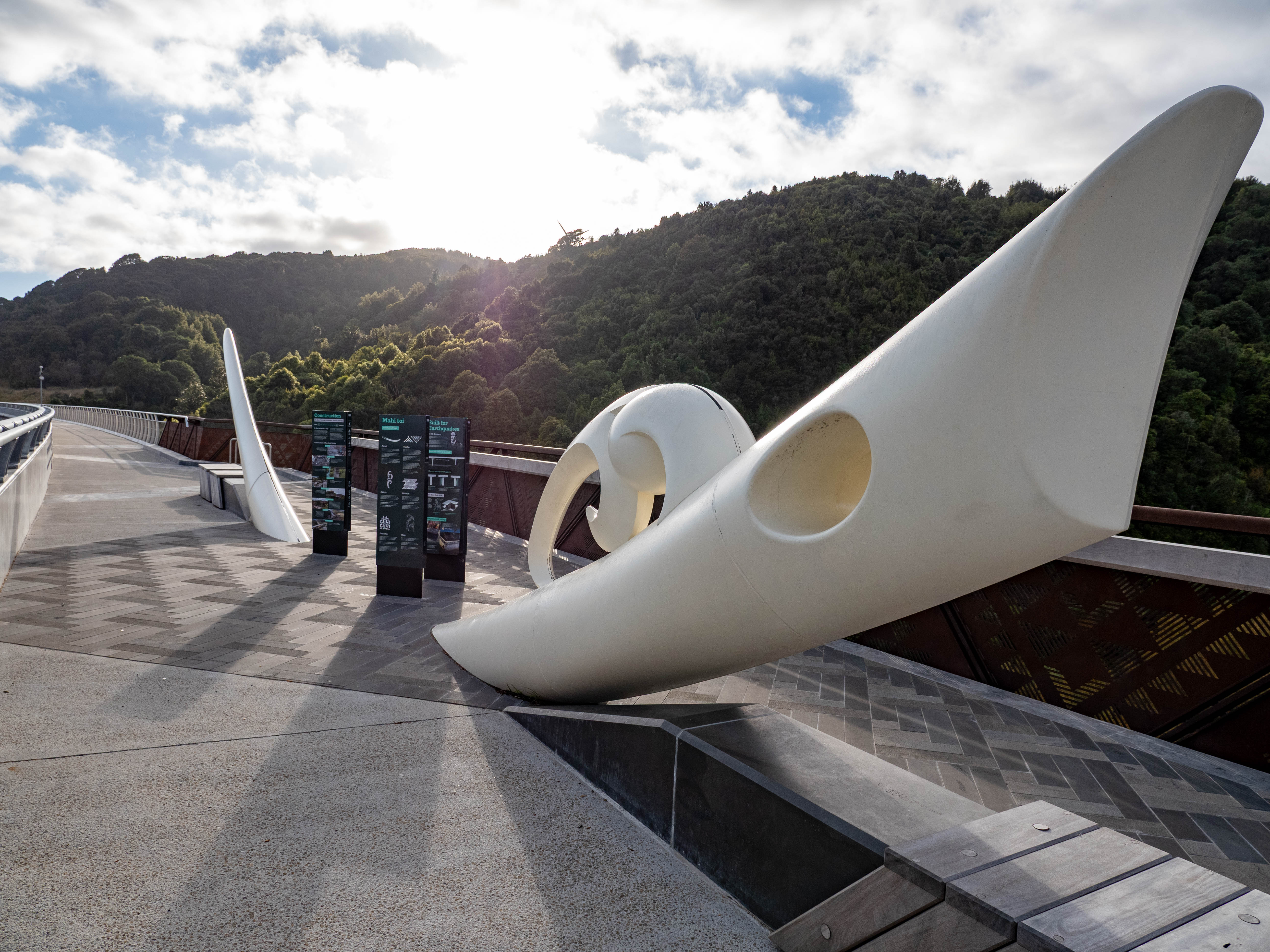 Mahi Toi and signs on Parahaki Bridge lookout.jpg