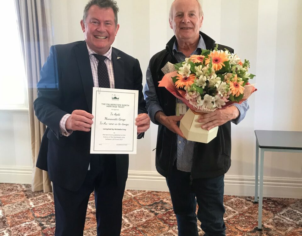 Palmerston North Mayor Grant Smith with award for Manawatu Gorge book